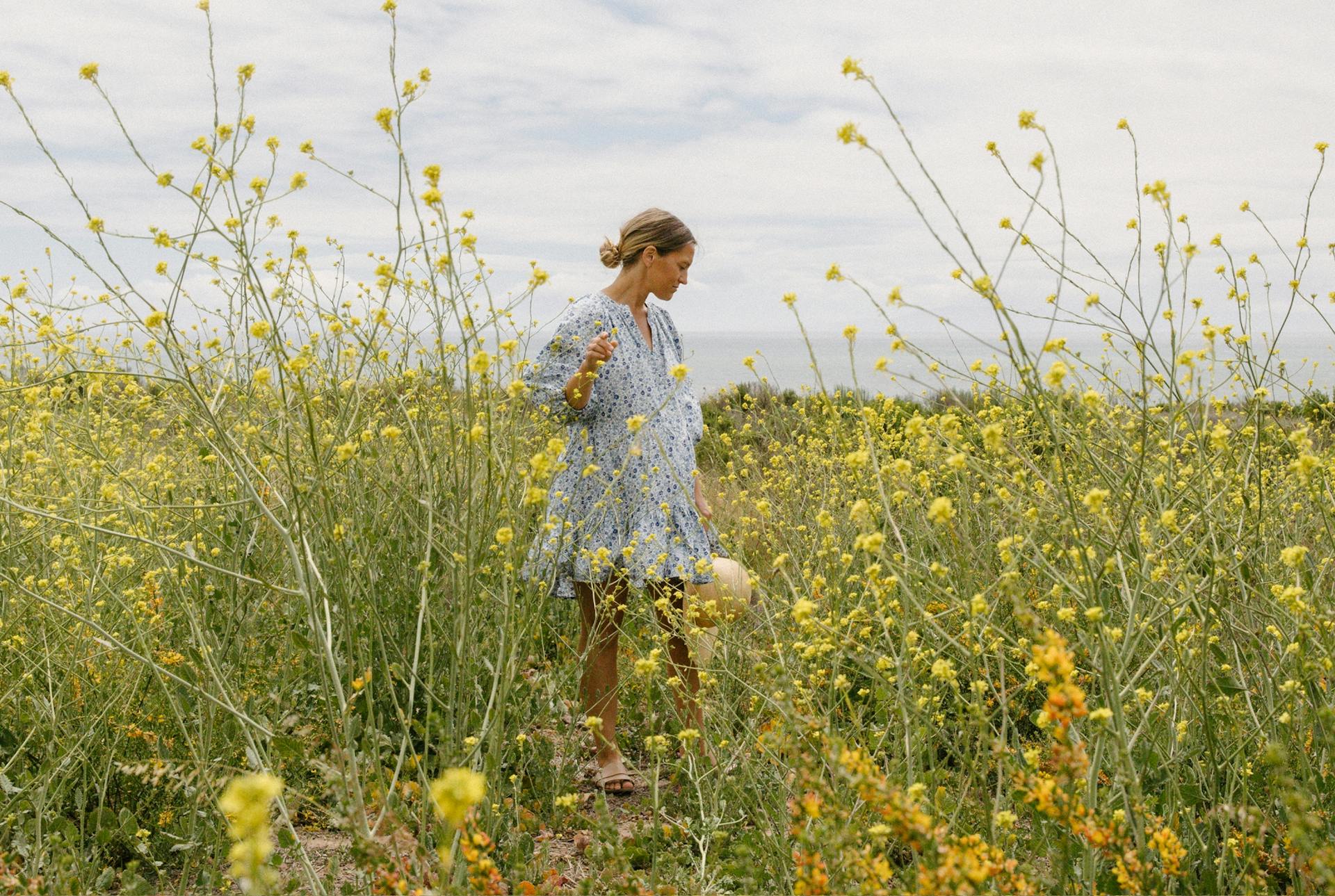 Julie Pointer Adams walks in an overgrown field
